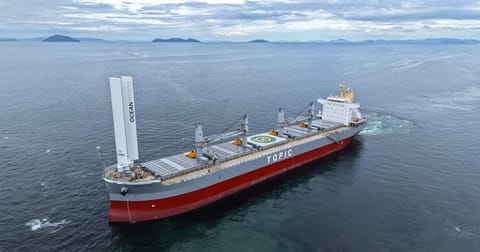 bulker with wind propulsion and solar panels for electricity
