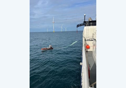 wind turbine blade being retrieved in North Sea
