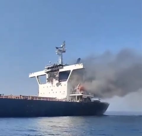 bulker on fire after being struck by projectiles