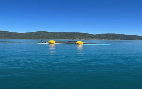 capsized racing yacht