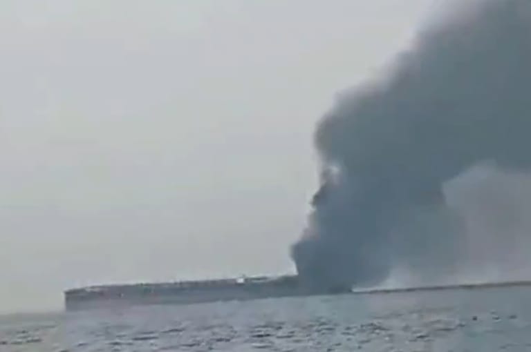 Iranian state media released a video of a tanker in ballast, smoke pouring from its stern (Iranian state media)