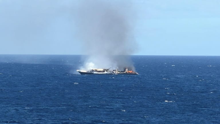 Drennec, her mast collapsed, burns off the Galapagos (USCG)