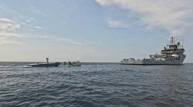 A T38 drone approaches a towed refueling sled deployed by USNS Vindicator (USN)