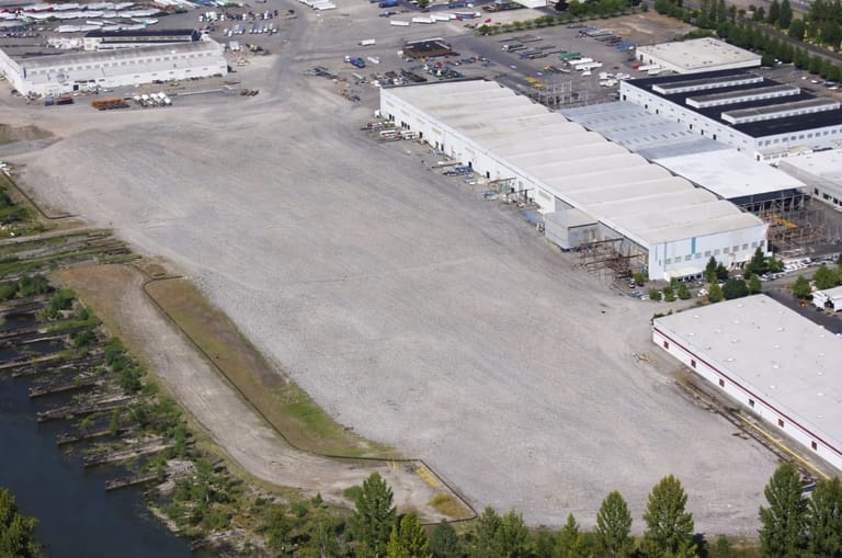 The original Kaiser assembly sheds, upper right, are home to New Pacific's operations. The old yard's slipways, far left, can still be discerned (New Pacific)