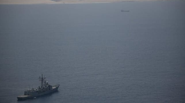 Op Atalanta frigate keeping an eye on a vessel seized by pirates off Puntland (Op Atalanta)