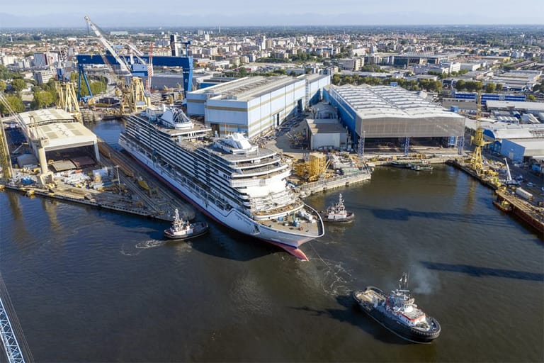 cruise ship leaving building dock