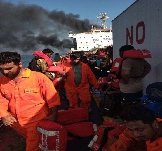 seafarers abandoning ship after attack near Strait of Hormuz