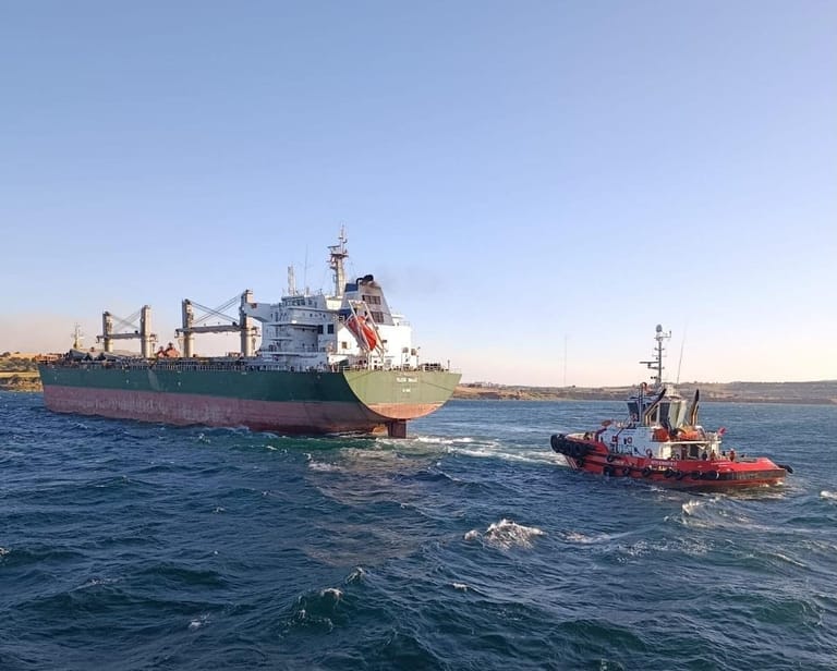 Turkish tug towing stranded bulker
