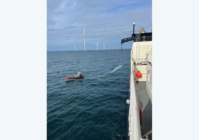 wind turbine blade being retrieved in North Sea