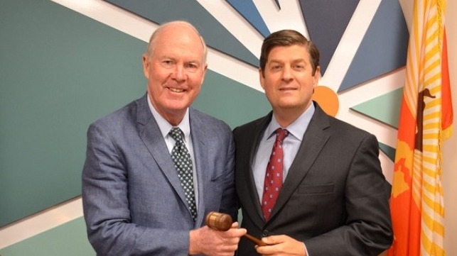 JAXPORT incoming Chairman John Baker (L) accepts the gavel from Immediate Past Board Chairman John Falconetti.