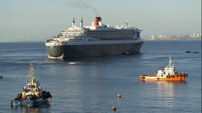 The 2,695-passenger Cunard flagship Queen Mary 2 (built 2003, refitted 2016) maneuvering in the port of Valparaiso in Chile / Credit: Inchcape