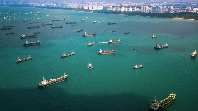 Vessels berthing at Singapore, the world’s largest bunkering hub and busiest container port globally