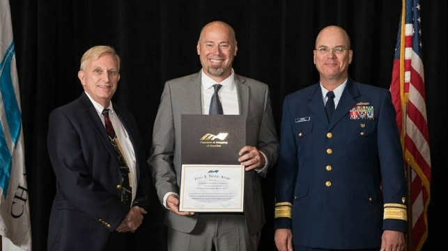 Jim Varley, Chairman CSA; Captain Jerry Bowers, MV American Liberty; and Rear Admiral Richard V. Timme, Commander, Eighth Coast Guard District