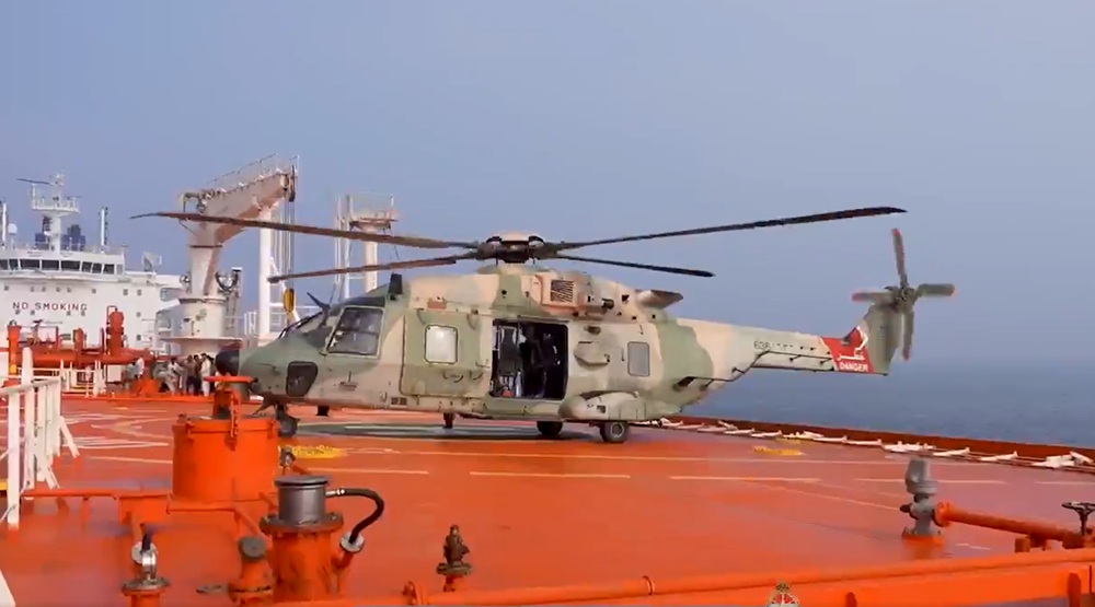 An Omani Air Force helicopter lands aboard On Peace to medevac injured seafarers (Oman MOD)