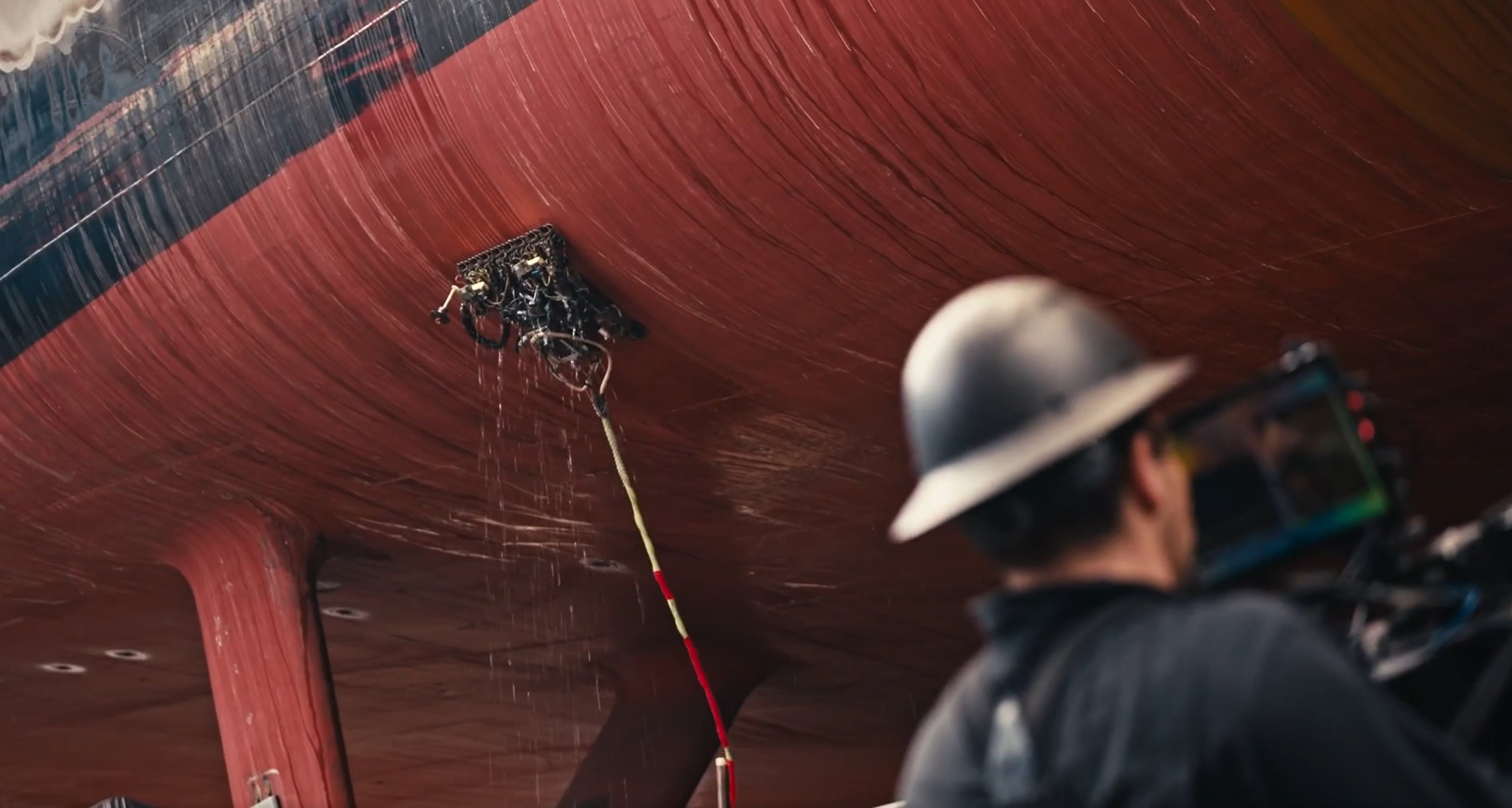 A team of Gecko engineers inspects the hull of a frigate with a robotic ultrasonic scanning device (file image courtesy Gecko)