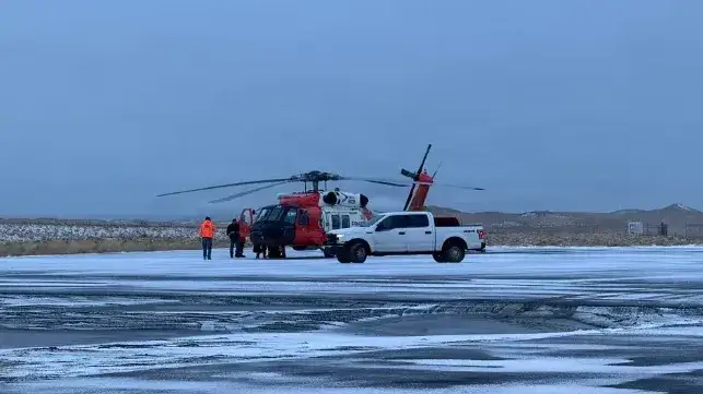 A Coast Guard helicopter arrives in St. Paul, delivering the survivors (USCG)