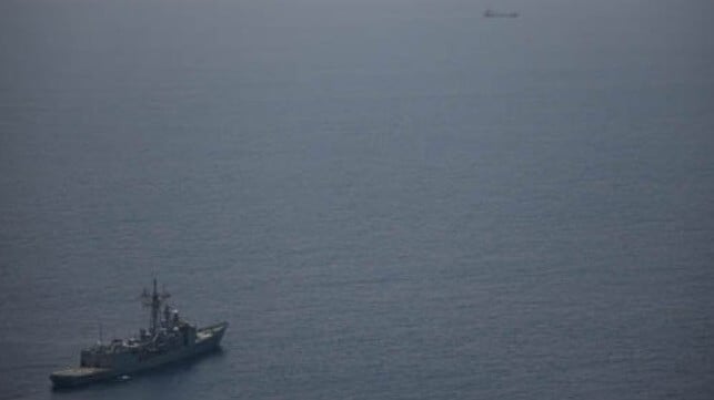 warship monitoring hijacked vessel