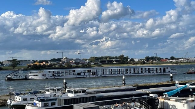 hull of river cruise ship arriving for outfitting