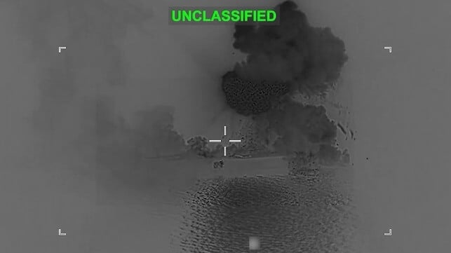 Debris cascades off the stern of IRIS Shahid Bagheri after a direct hit, March 5 (US Central Command)