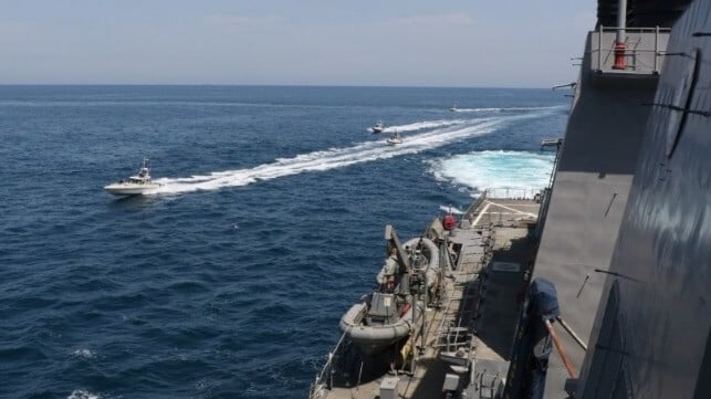 At Hormuz, two options ahead: the IRGC Navy, seen at left, or the U.S. Navy, at right (USN file image)