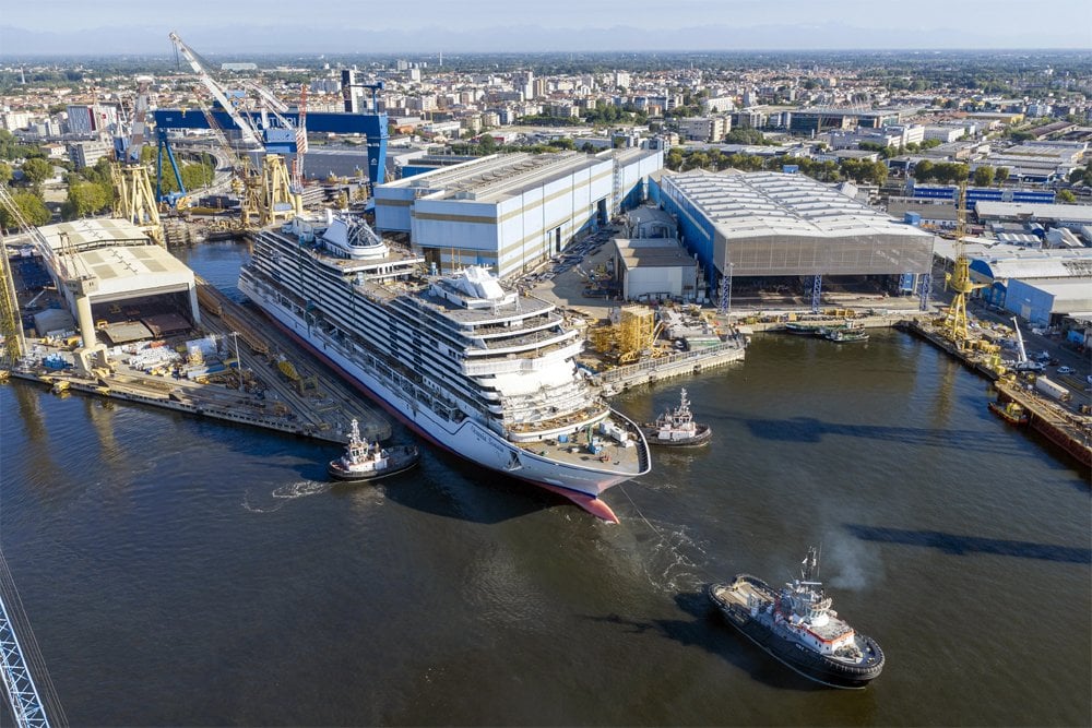 cruise ship leaving building dock