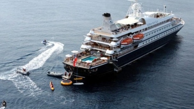 passenger await direction of suspended Caribbean cruise