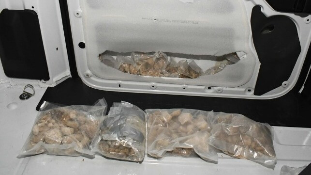Door panel filled with bags of drugs