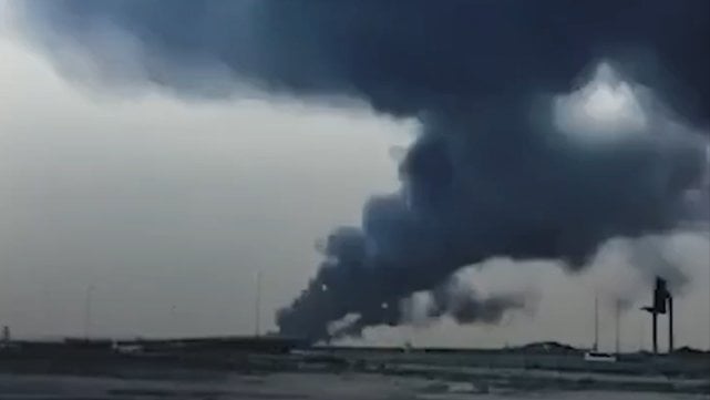 smoke rising from Kuwait port