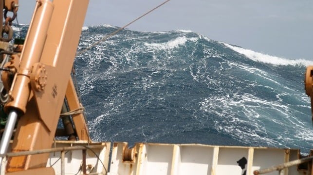 A large wave towering astern of the NOAA Ship Delaware II in 2005 while crossing the Atlantic Ocean's New England Seamount Chain.