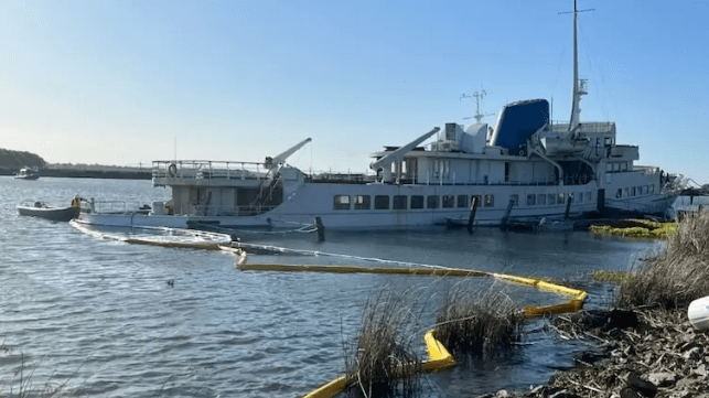 Derelict cruise ship sunk at berth
