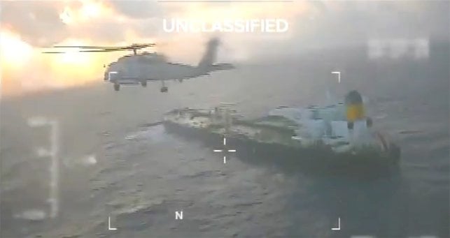 US helicopter above crude oil tanker