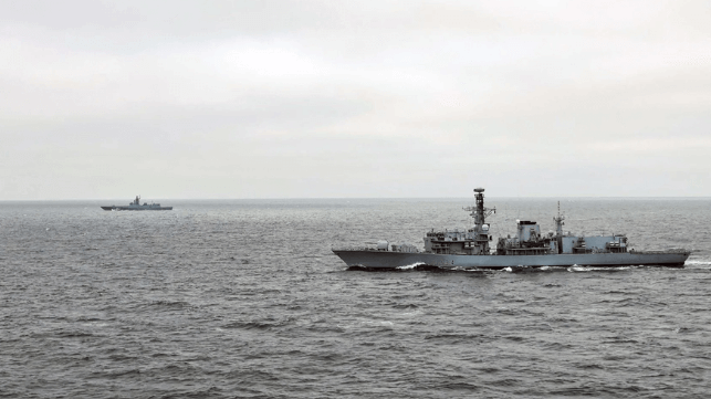 HMS Iron Duke (nearest camera) monitoring RFS Golovko in the English Channel