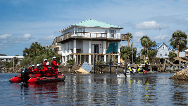 Coast Guard boat crew surveys the wreckage in Keaton Beach, Florida (USCG)