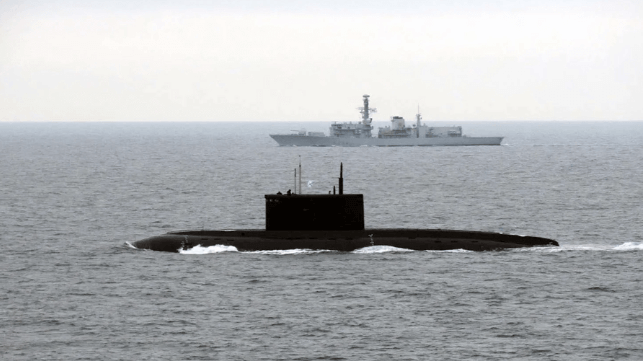 HMS Iron Duke (background) with the Russian Kilo-class sub Novorossiysk (Royal Navy)