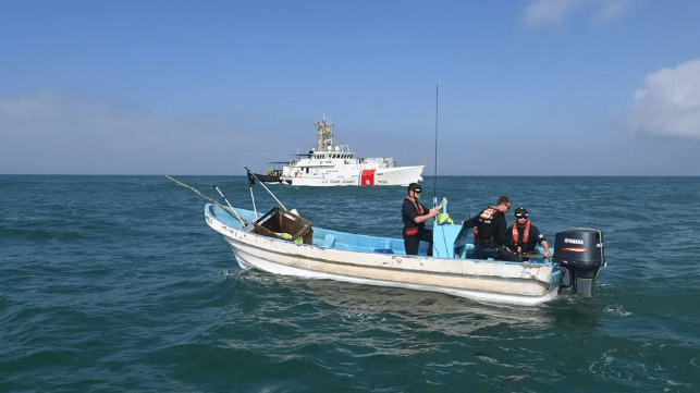 A U.S. Coast Guard crew inspects a lancha seized in the U.S. Gulf of Mexico for illegal fishing (USCG file image)