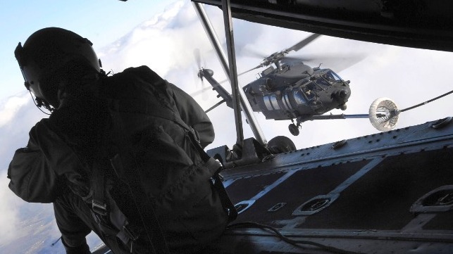 An MH-60 helicopter refuels from a special operations transport plane (file image courtesy U.S. Army)