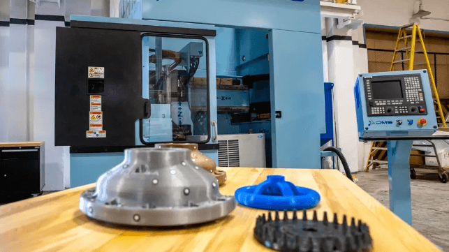 3D printed metal and plastic parts at the Norfolk Naval Shipyard's additive manufacturing center, 2021 (USN)