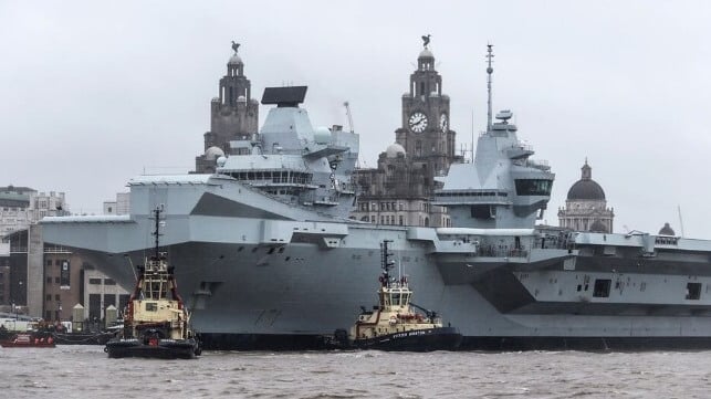 tugs assisting Prince of Wales