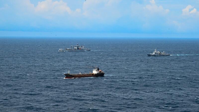 New Zealand warships monitoring vessel