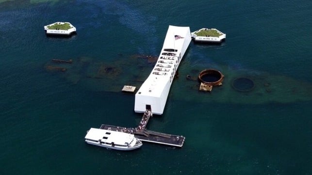 The two small salvage platforms are visible on either side of the USS Arizona Memorial building. The white concrete dolphins in the background will remain intact (USN)