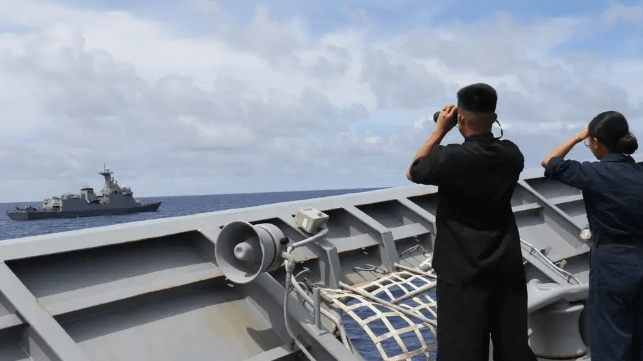 The crew of cruiser USS Lake Erie stand watch during a joint sailing with a Philippine Navy vessel in the S. China Sea, August 2024 (USN)