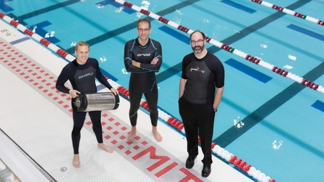 From left, graduate student Anton Cottrill, Dr. Jacopo Buongiorno and Dr. Michael Strano try out their neoprene wetsuits at a pool at MIT?s athletic center. Cottrill is holding the pressure tank used to treat the wetsuits with heavy inert gasses. (Courtesy photo/Susan Young)