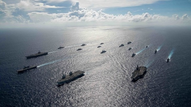 RSS Vigour and RSS Formidable from the Republic of Singapore Navy and the UK Carrier Strike Group's HMS Queen Elizabeth exercising together on 9 October 2021. [Photo: Royal Navy]