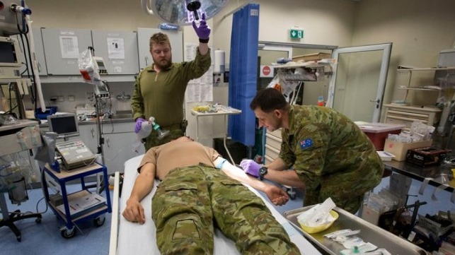 Lieutenant Commander Gavin Milkins (right) and Leading Seaman Peter Gough conduct training at the Role 2 Enhanced NATO Medical Treatment Facility at Hamid Karzai International Airport, Kabul, Afghanistan.