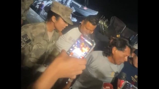 Maximo Napa Castro (right) reunited with his brother Alberto (center) and received a hero's welcome on his return to shore in Peru (Alberto Napa Castro)