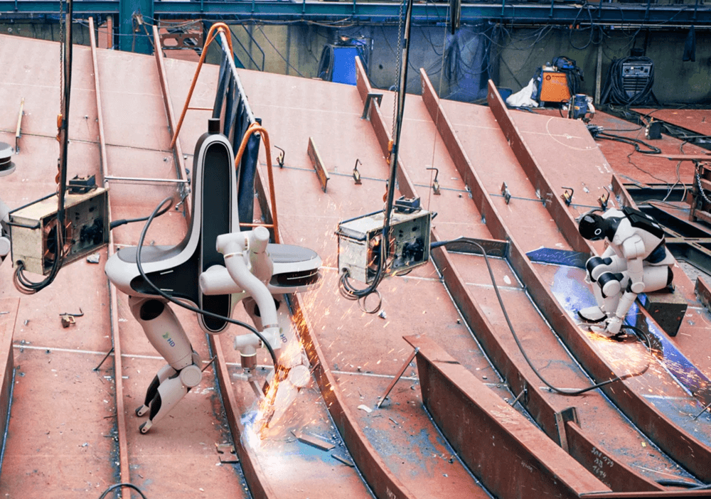 Welding robots at work on a panel at HD Hyundai (HD Hyundai)