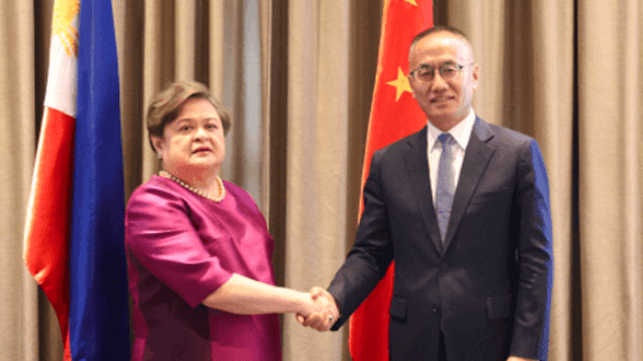 Diplomats Theresa Lazaro and Chen Xiaodong shake hands after a meeting in Manila (Chinese Ministry of Foreign Affairs)