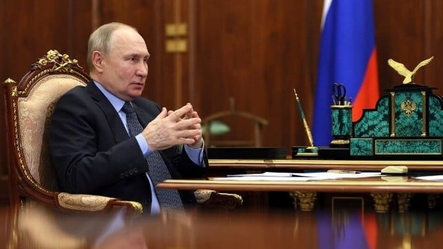 Vladimir Putin at an ornate desk