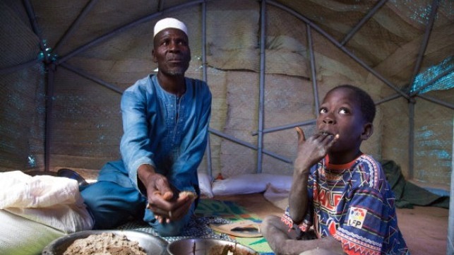 Photo: WFP/ Marwa Awad, A family eating their meal in Burkina Faso