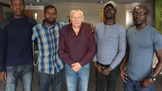 Ken Fleming with Joshua, James, Noel and John who were saved from an Irish fishing vessel.